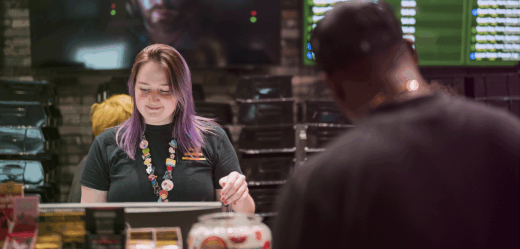 A Stairway Cannabis employee rings up a purchase of a first time dispensary customer.