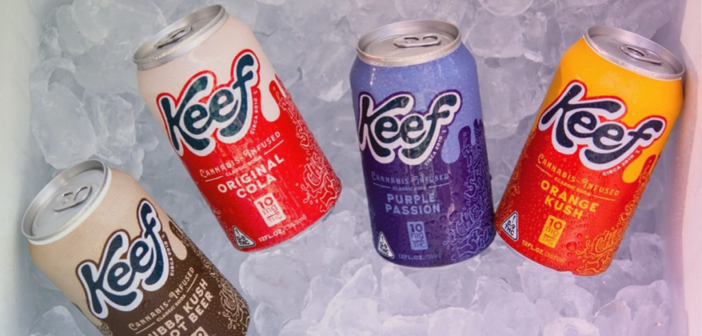 A close up of four Keef Drinks on ice in a cooler.